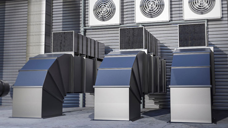 Three silver vents side by side with each one of them having a fan untop